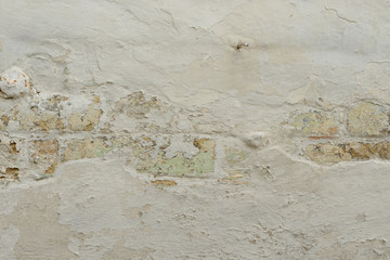Wall fragment with scratches and cracks