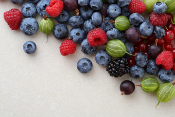 Berries mix over concrete background