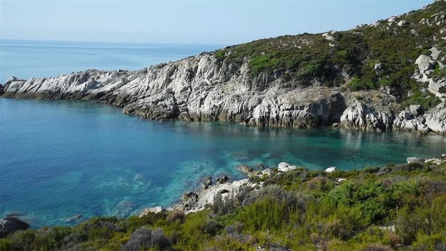 Panning shot of a beautiful hidden bay on Sithonia peninsula, Chalkidiki, Greece