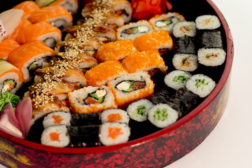 Sushi set with diferrent sushi rolls in red box