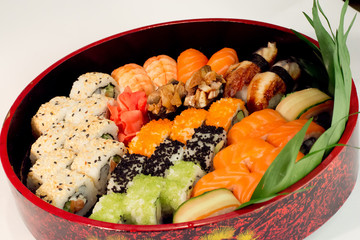 Sushi set in red box, sushi rolls - asian culture