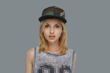 Portrait of modern hip hop female in a cap.