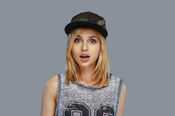 Portrait of hip hop female in baseball cap.