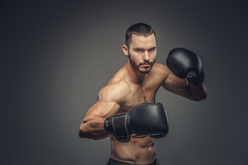 Male fighter in boxing gloves.