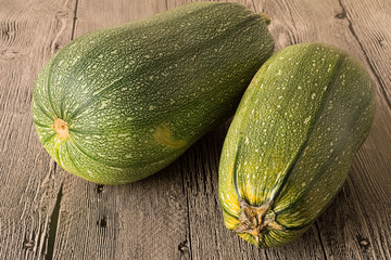 Courgettes.   Freshly picked courgettes on a wooden table.