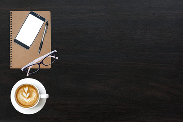 Office desk wood table of Business workplace, notebook Laptop and mobile Phone Smartphone coffee cup, Top view with copy space.