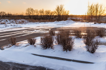snow covered countryside at sunset