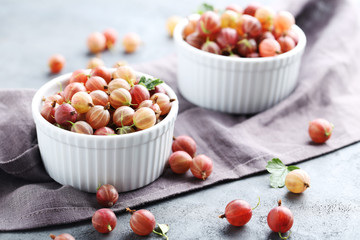 Gooseberries fruit on a grey table