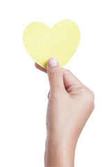 Fototapeta premium A female hand holding paper heart, isolated on white background. with using path