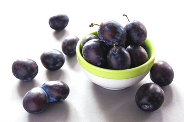 Sweet ripe plums on rustic background. Close-up.