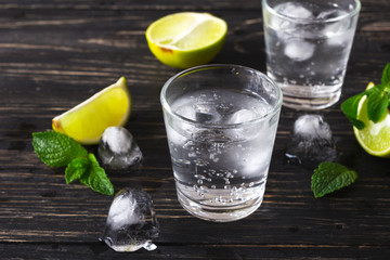 Cocktail with soda water, ice, lime and mint