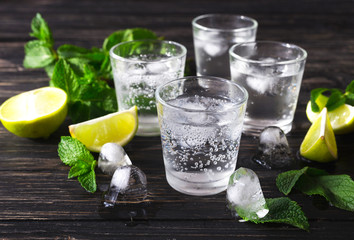 Cocktail with soda water, ice, lime and mint