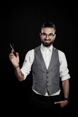 stylish hairdressers in the studio with scissors and comb