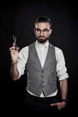 stylish hairdressers in the studio with scissors and comb