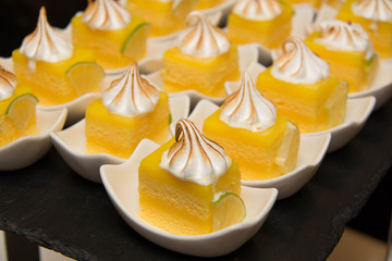 Obraz na płótnie Canvas Mini lemon meringue cake with cream top