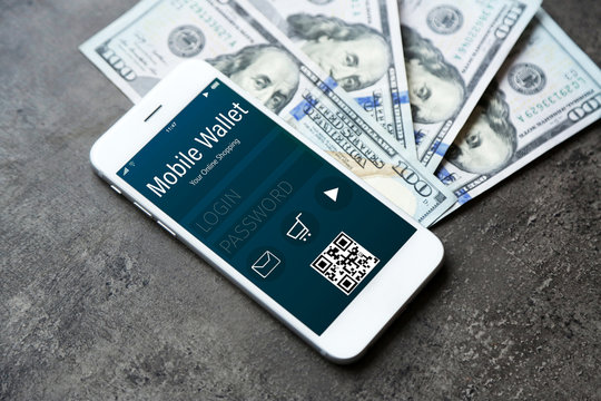 Smartphone with mobile wallet application on screen. E-commerce concept.