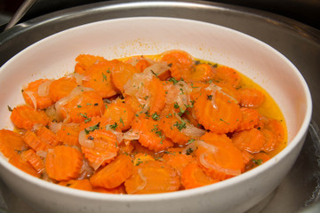 Carrots with butter in a white bolw