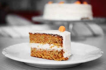 Tasty slice of carrot cake on white plate