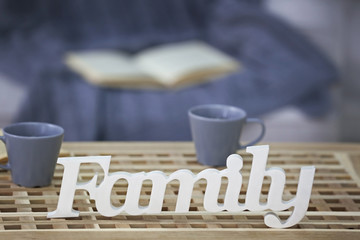 Word Family on wooden table in room