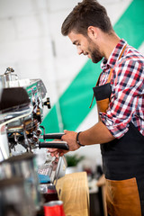 Employed pours coffee