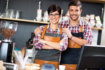 owner  coffee shop smiling couple