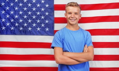 Cute boy on American flag background