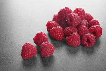 Fresh raspberry on grey table