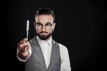 stylish hairdressers in the studio with blade for razor