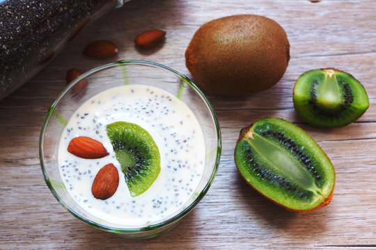 Top View Of Chia Seed With Almond Milk Pudding Topping With Kiwi Fruit And Almond.