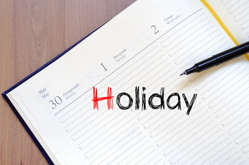 Holiday text concept on notebook