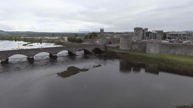King John castle and thomond bridge in Limerick - Ireland - Famous Limerick Public tourist attraction.