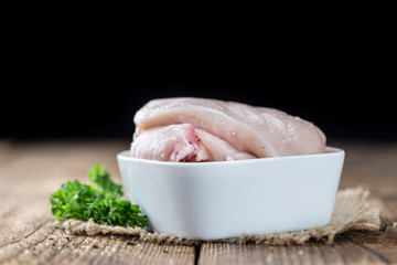 Old wooden table with raw Chicken Cutlet