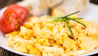 Tuinposter Plate with scrambled Eggs (close-up shot) © HandmadePictures