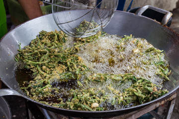 Vegetable fritters on pan