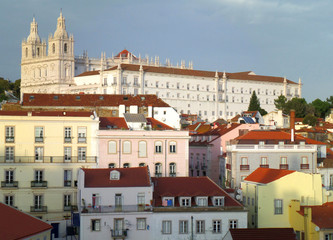 Red Rooftops with Pastel Colored Facade of Lisbon Cityscape View from Alfama Neighborhood, Portugal 