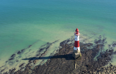 Lighthouse on a sunny day in Seven Sisters, England.