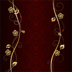 Gold floral pattern on dark background.