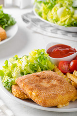 Fried cheese with french fries and lettuce