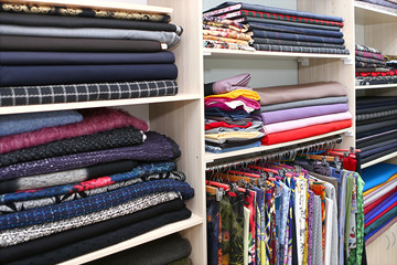 Shelves with fabric in fashion house