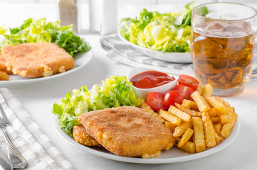 Fried cheese with french fries and lettuce