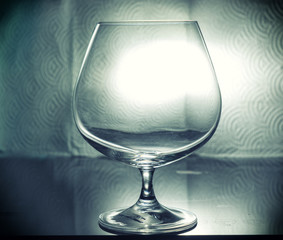single whisky glass on table and vintage filter