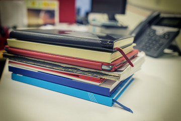 row of book in the office with vintage filter present