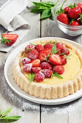 Strawberry tart with lemon cream and mint .Selective focus 