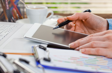 Hands close-up at the office in the composition of objects for business