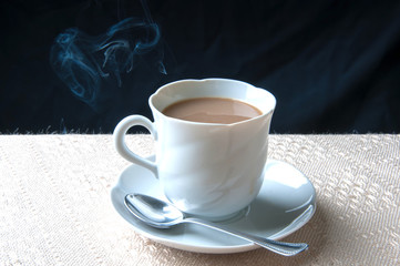 Cup of coffee with milk for breakfast