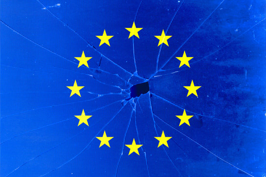EU flag with broken glass background, Braking European Union or EU concept.