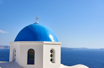 Fototapeta na wymiar The view of the Aegean sea with white church on Santorini, Greece