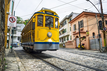 Iconic bonde tram travels along the streets of the tourist nieghborhood of Santa Teresa in Rio de Janeiro, Brazil  - 118183731