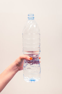 Women hand hold big clean water bottle to let drinking much water every day for healthy concept.