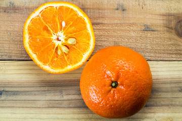 Fresh orange on wooden table